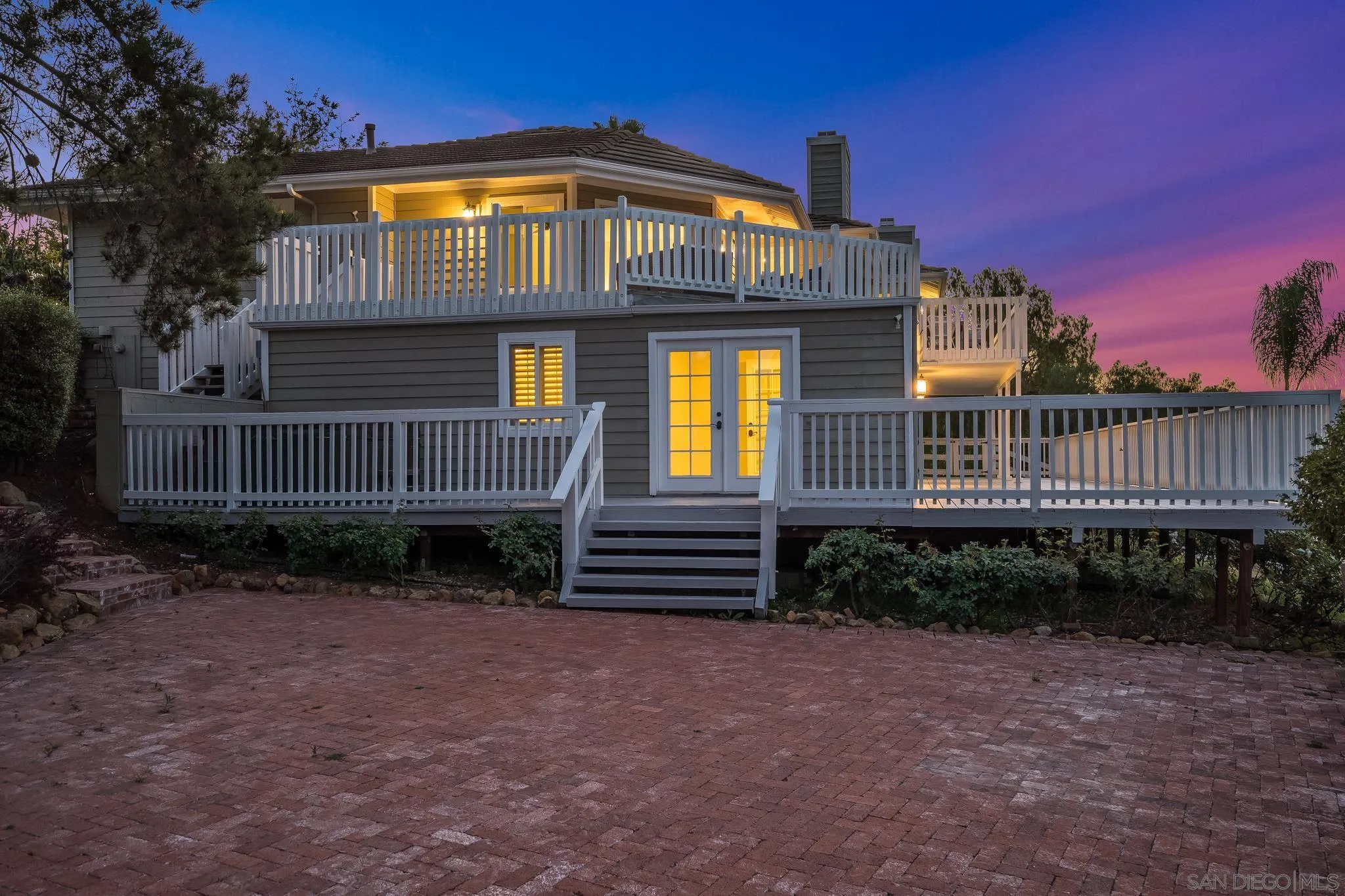 1482 Rancho Encinitas Drive Encinitas, CA 92024 - Photo 6 of 75 a front view of a house with a yard