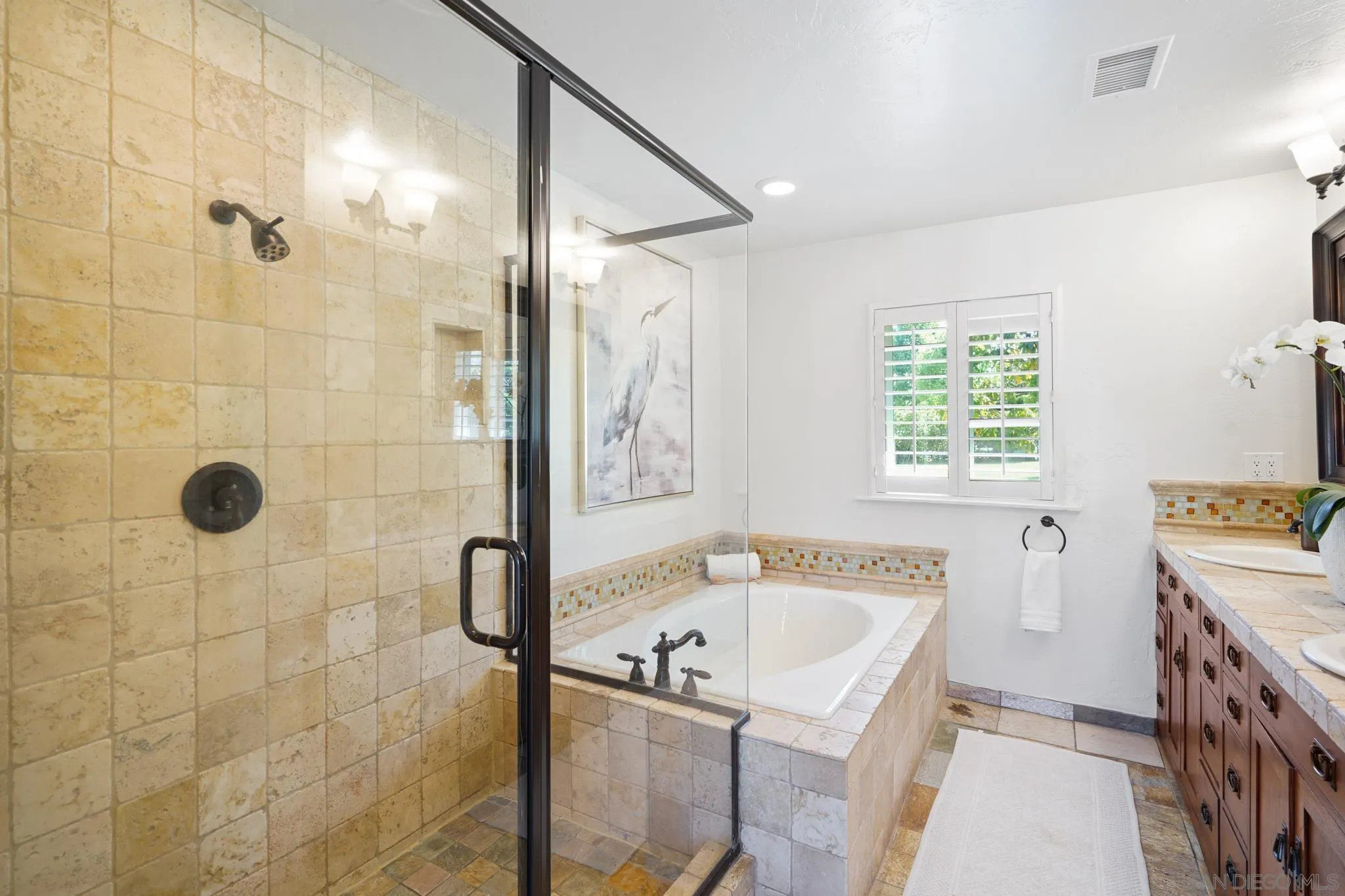 1482 Rancho Encinitas Drive Encinitas, CA 92024 - Photo 63 of 75 a bathroom with a tub sink and mirror