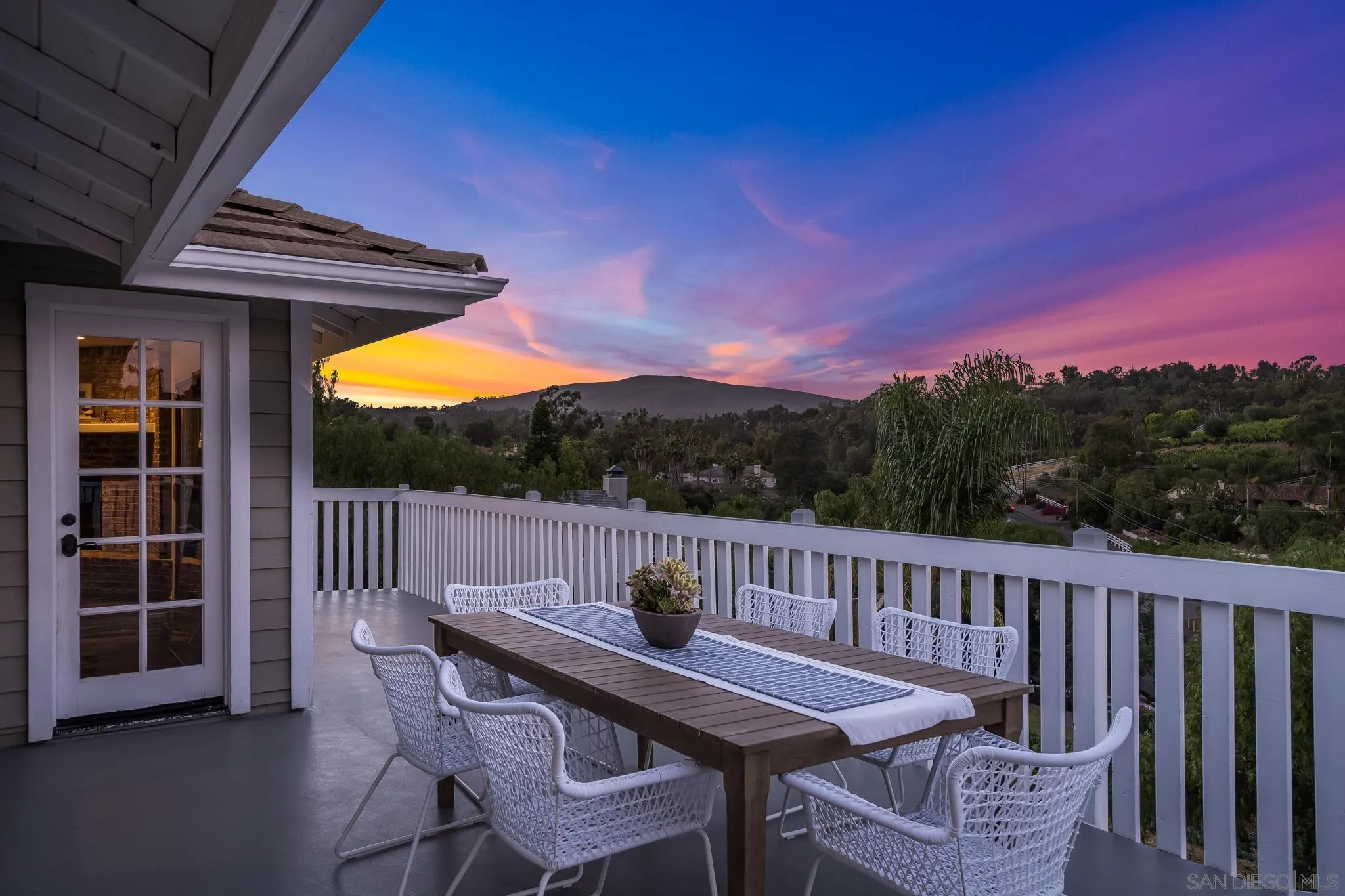 1482 Rancho Encinitas Drive Encinitas, CA 92024 - Photo 9 of 75 a view of a deck with a table and chairs