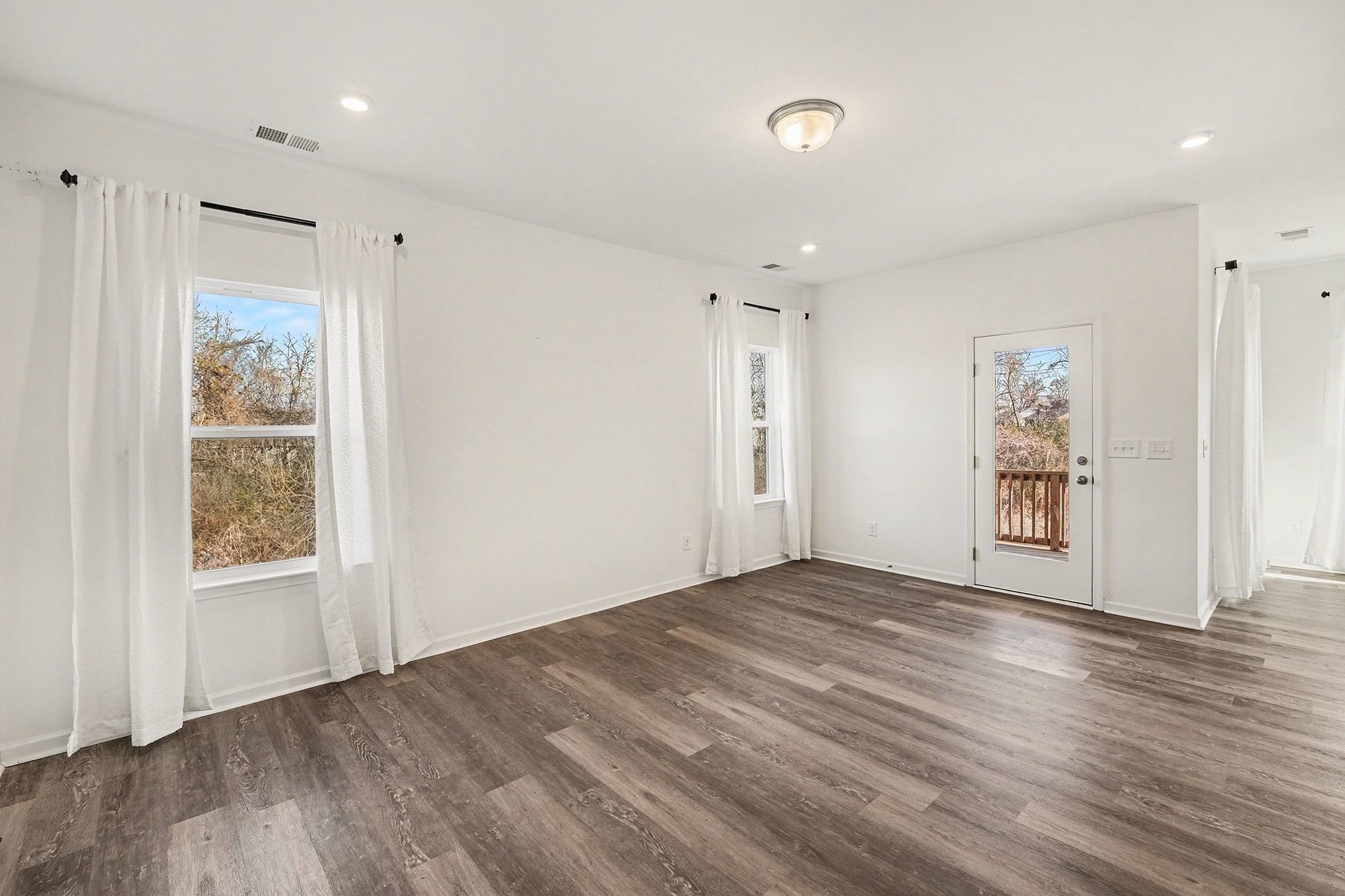 1972 Susan Road Columbia, TN 38401 - Photo 12 of 29 a view of an empty room with wooden floor and a window
