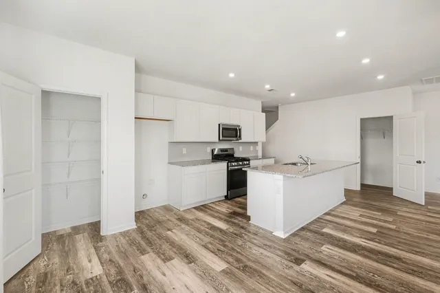 a view of kitchen with wooden floor