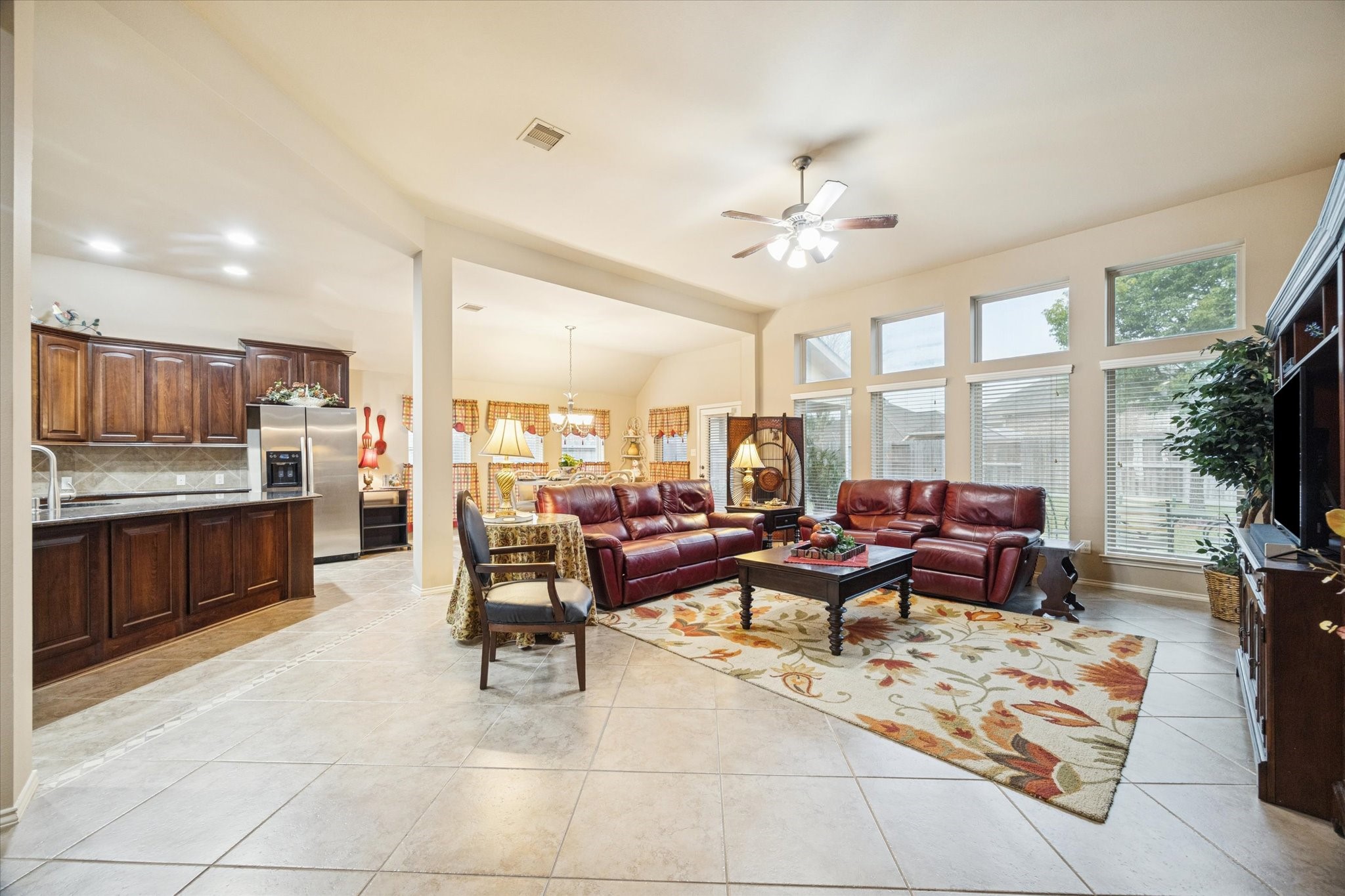 5231 Stoneridge Court Rosenberg, TX 77471 - Photo 16 of 31 The living area offers an open-concept feel with high ceilings and seamless flow to the kitchen and dining spaces—ideal for relaxing or entertaining.