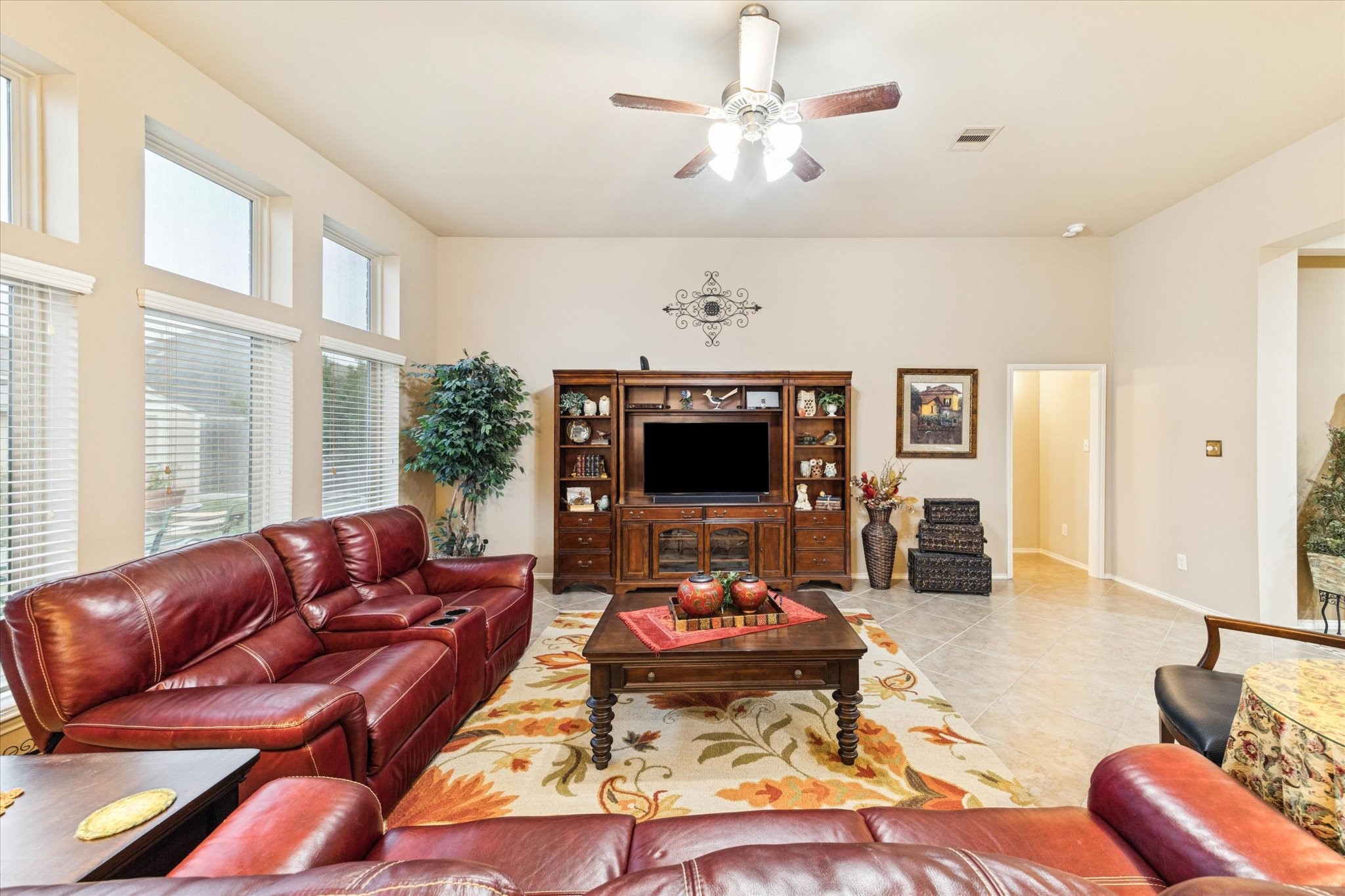 5231 Stoneridge Court Rosenberg, TX 77471 - Photo 17 of 31 Expansive living room featuring high ceilings, oversized windows, and a flexible layout ideal for comfortable gatherings or relaxing evenings.