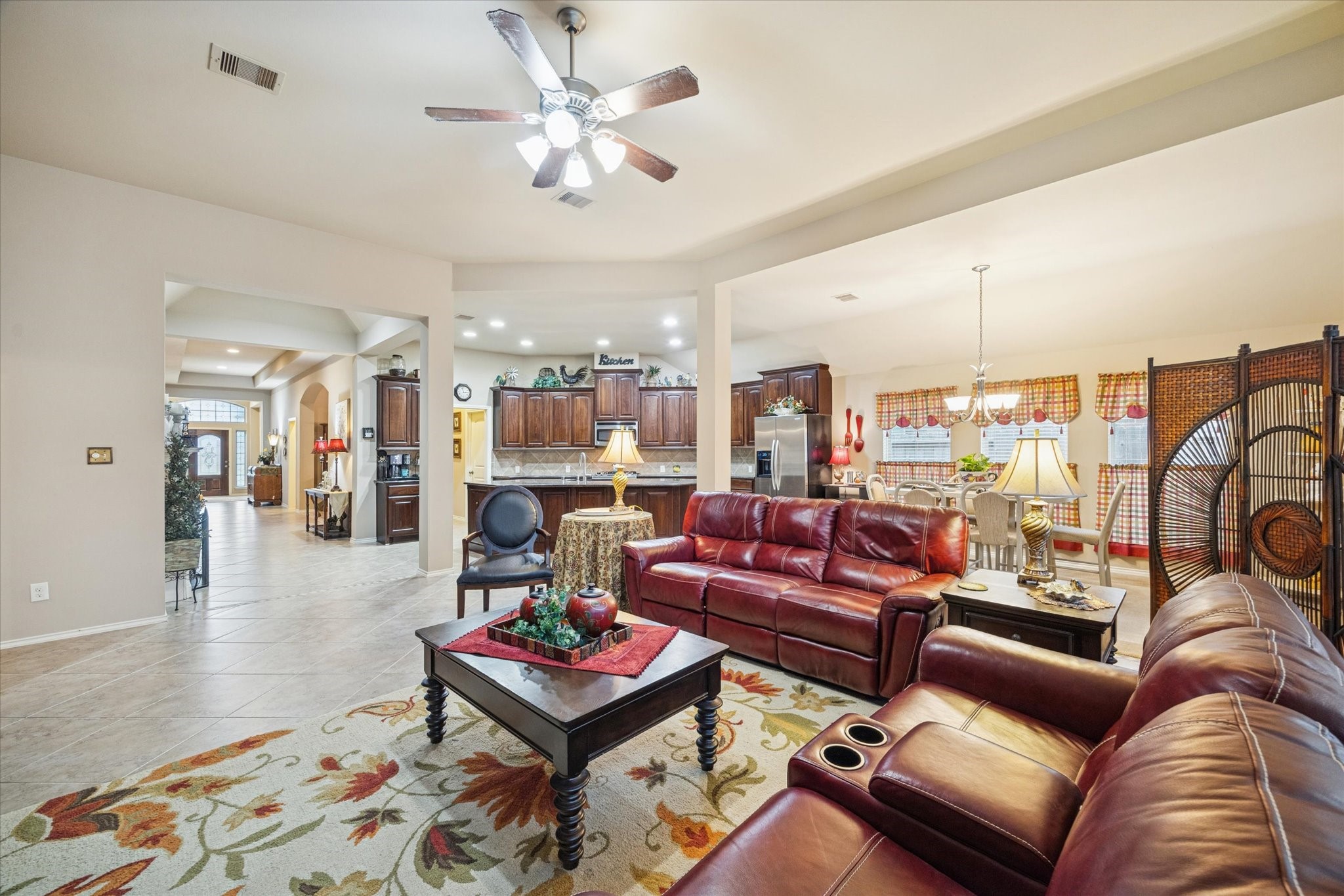 5231 Stoneridge Court Rosenberg, TX 77471 - Photo 18 of 31 This is where everyone gathers! Neutral tile flooring and abundant natural light create a warm and inviting atmosphere—