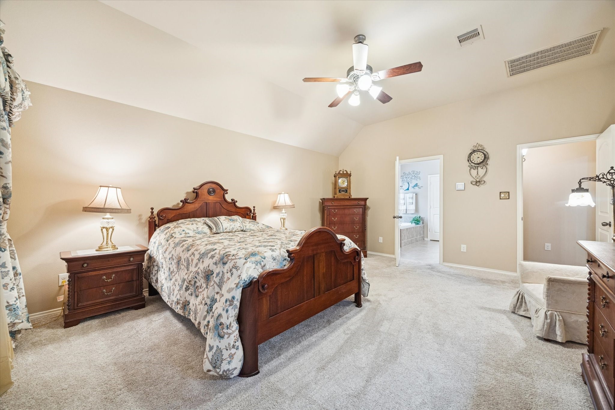 5231 Stoneridge Court Rosenberg, TX 77471 - Photo 20 of 31 Primary bedroom opens to a well-appointed ensuite bath featuring a generously sized walk-in closet located within the bathroom—ideal for both function and organization.