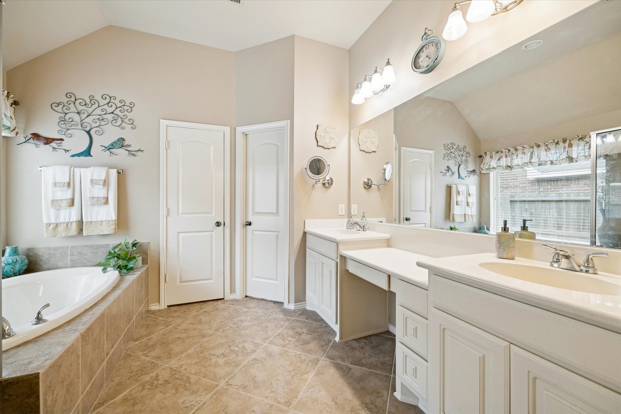 5231 Stoneridge Court Rosenberg, TX 77471 - Photo 21 of 31 Spa-inspired primary bath featuring dual vanities, soaking tub, separate glass-enclosed shower, and abundant storage.