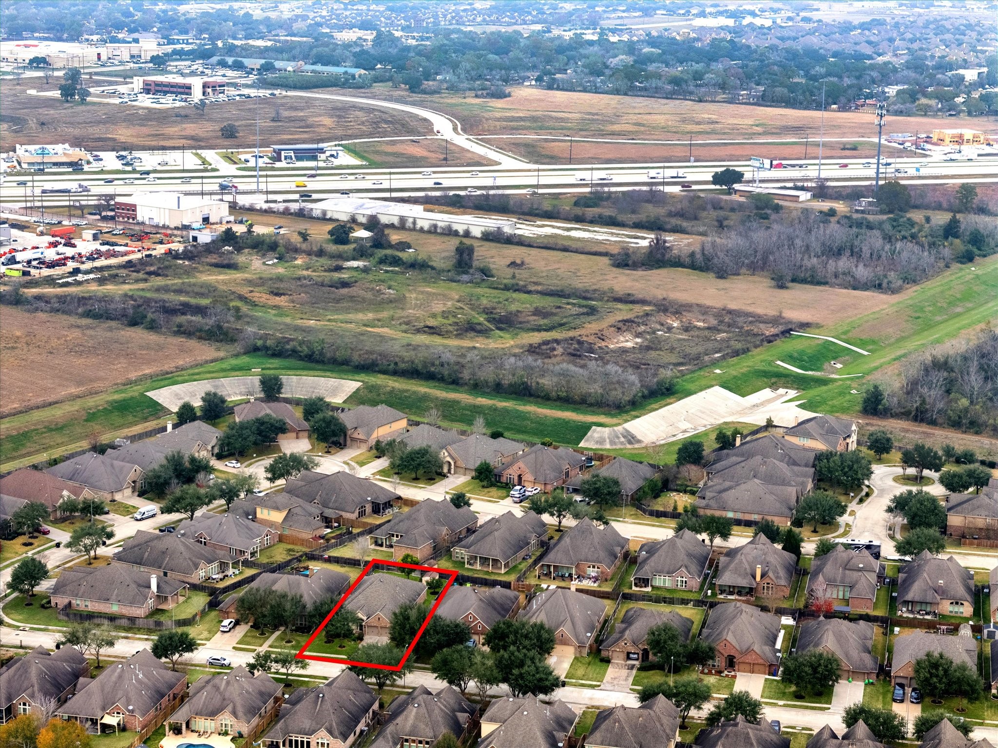 5231 Stoneridge Court Rosenberg, TX 77471 - Photo 30 of 31 Elevated aerial perspective showing the property’s proximity to Highway 59 and major conveniences. Enjoy easy access to shopping centers, hospitals, dining, and daily essentials while still tucked into a residential setting.