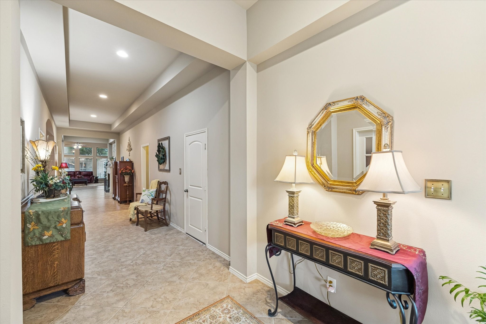 5231 Stoneridge Court Rosenberg, TX 77471 - Photo 3 of 31 A spacious foyer with tray ceiling and ceramic tile flooring creates an elegant first impression, offering a graceful transition into the heart of the home.