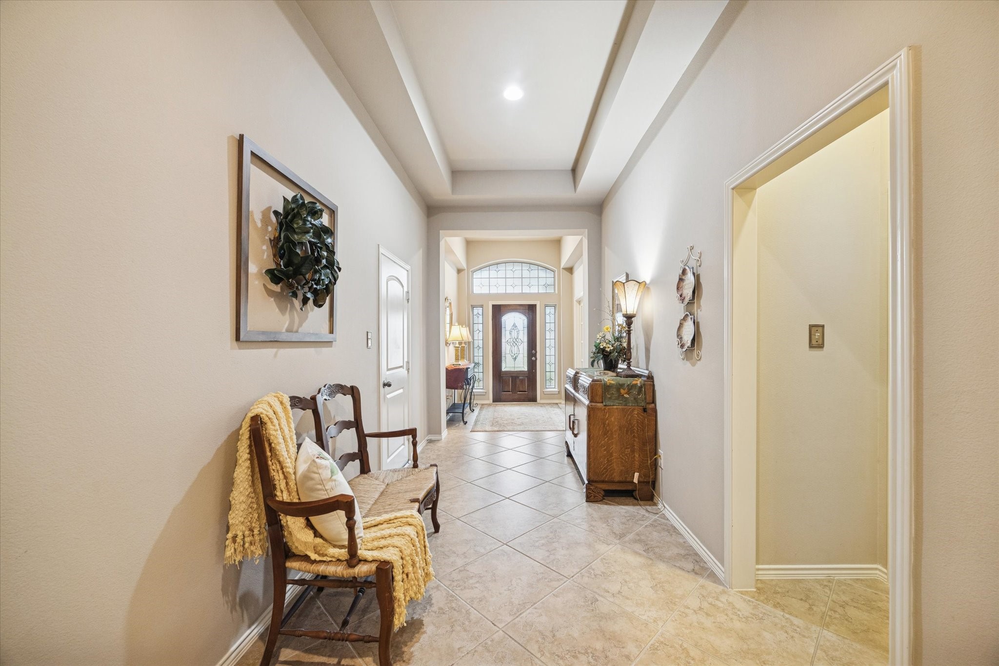 5231 Stoneridge Court Rosenberg, TX 77471 - Photo 6 of 31 Wide hallways with architectural ceiling details and soft neutral tones enhance the home’s open, flowing design while providing a sense of scale and sophistication.