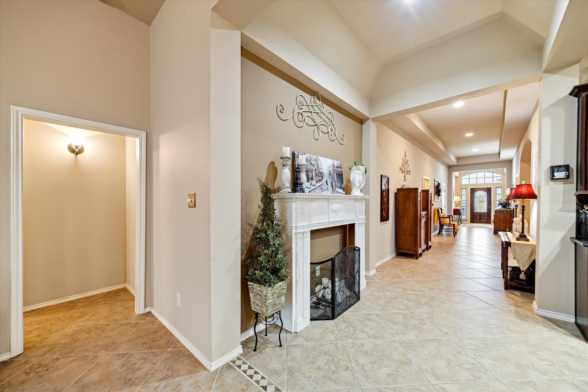 5231 Stoneridge Court Rosenberg, TX 77471 - Photo 10 of 31 The hallway off the foyer leads to the primary suite—nicely tucked away for a little extra peace and privacy.
