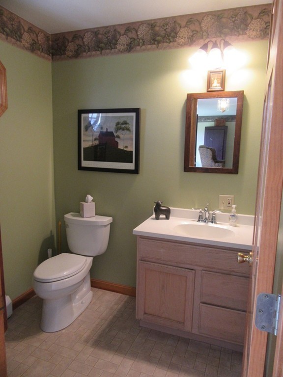 156 Reed Street Warren, MA 01083 - Photo 13 of 30 a bathroom with a toilet sink and mirror