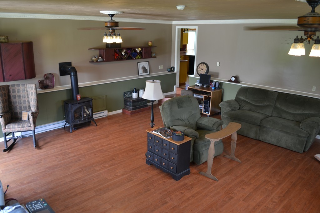 156 Reed Street Warren, MA 01083 - Photo 3 of 30 a living room with furniture a dining table and chairs with wooden floor