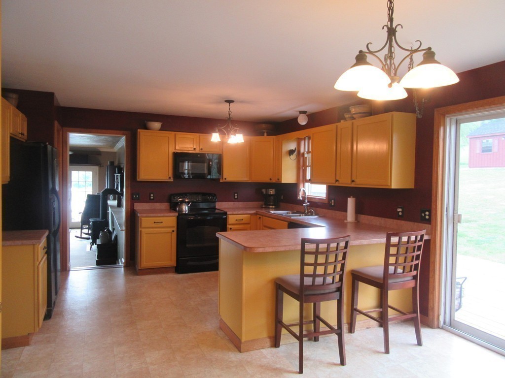156 Reed Street Warren, MA 01083 - Photo 6 of 30 a kitchen with a table and chairs in it