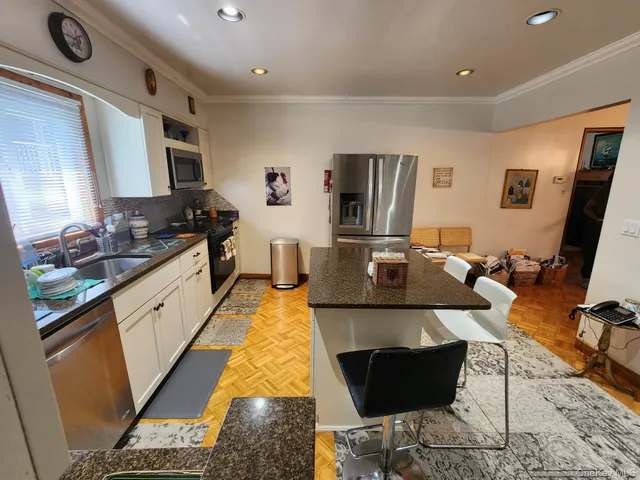 a kitchen with a sink and a stove top oven