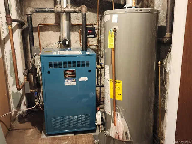 a view of walk in closet with wooden floor and windows