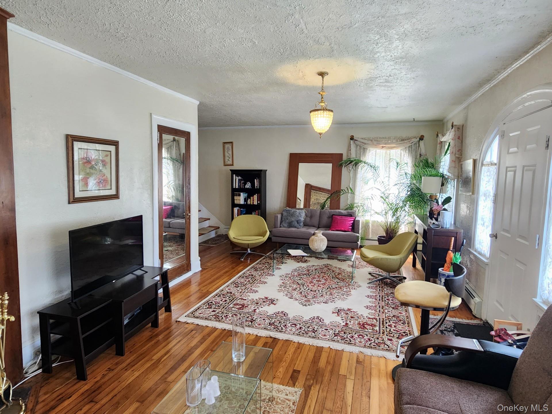 19 Esplanade Mount Vernon, NY 10553 - Photo 5 of 50 a living room with furniture and a flat screen tv
