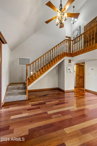 a kitchen with a refrigerator and cabinets