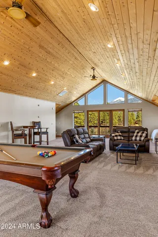 a view of patio with barbeque and furniture