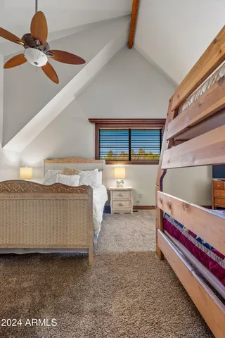 a view of a patio with table and chairs and wooden floor
