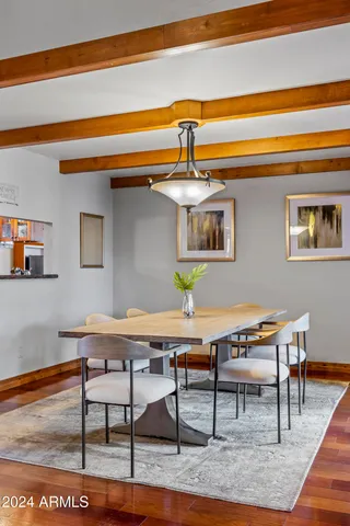 a bedroom with a bed and a refrigerator