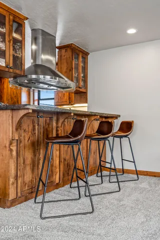 a bedroom with furniture and a flat screen tv