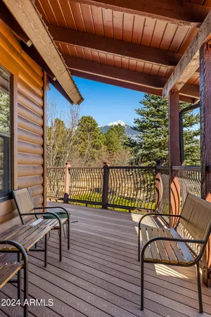 a view of a chairs on wooden deck