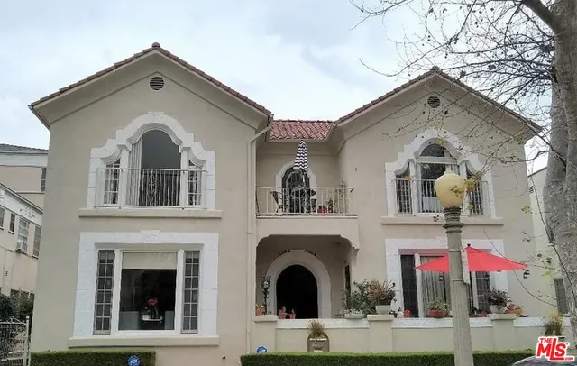 a front view of a house with yard