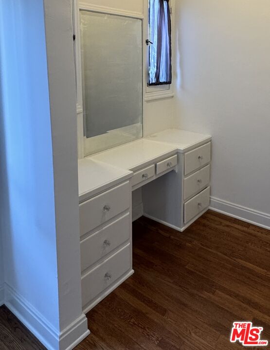 328 North Sycamore Avenue Los Angeles, CA 90036 - Photo 25 of 29 a bathroom with a sink and a mirror