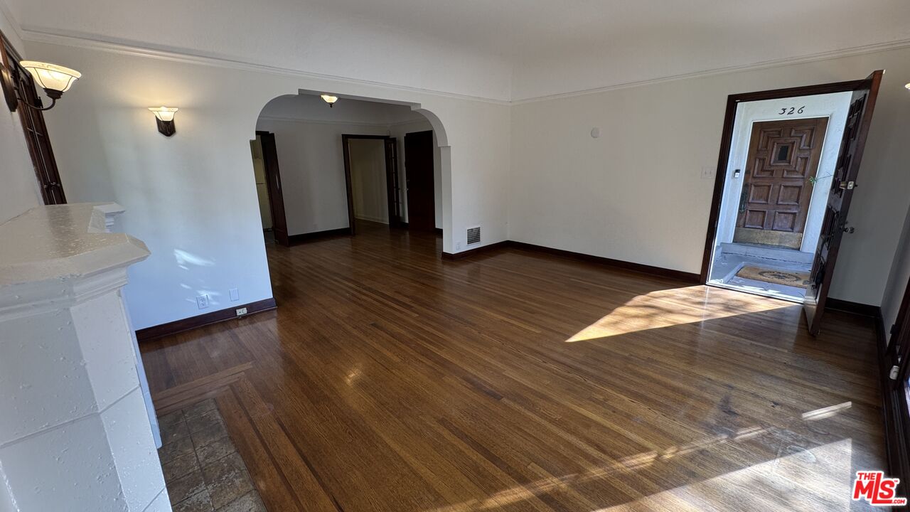 328 North Sycamore Avenue Los Angeles, CA 90036 - Photo 29 of 29 a view of a hallway with wooden floor and stairs