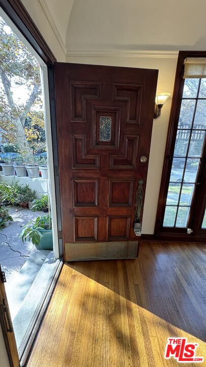 328 North Sycamore Avenue Los Angeles, CA 90036 - Photo 4 of 29 a view of front door with wooden floor