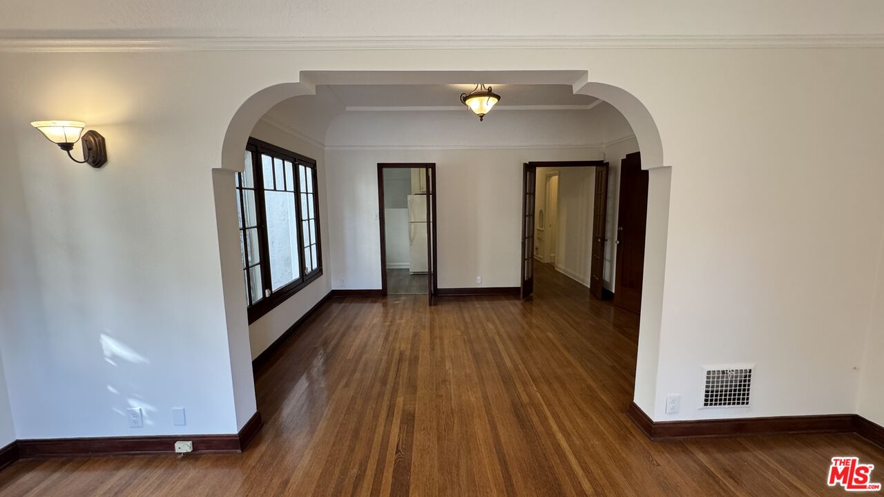 328 North Sycamore Avenue Los Angeles, CA 90036 - Photo 7 of 29 a view of hallway with wooden floor