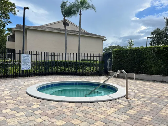 a view of a swimming pool with a patio