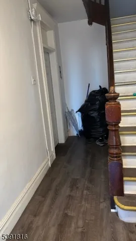 a view of entryway with wooden floor