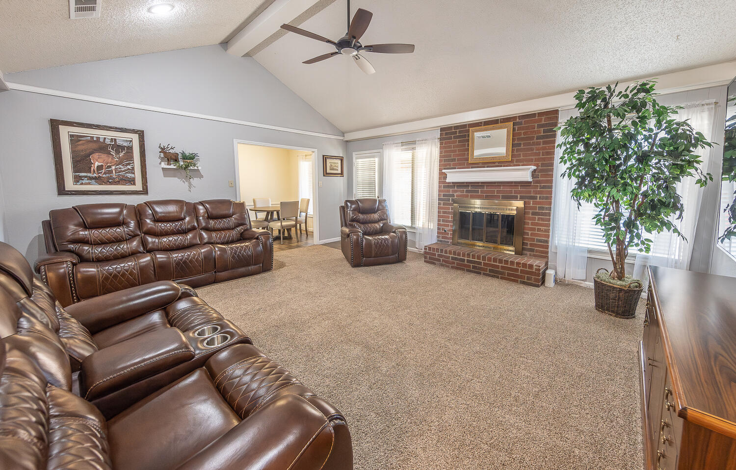 5810 80th Street Lubbock, TX 79424 - Photo 2 of 29 a living room with furniture and a fireplace