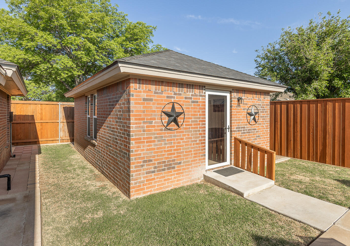 5810 80th Street Lubbock, TX 79424 - Photo 25 of 29 a view of a house with a yard