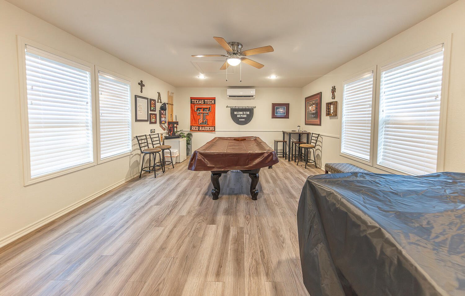5810 80th Street Lubbock, TX 79424 - Photo 26 of 29 a living room with furniture and a wooden floor
