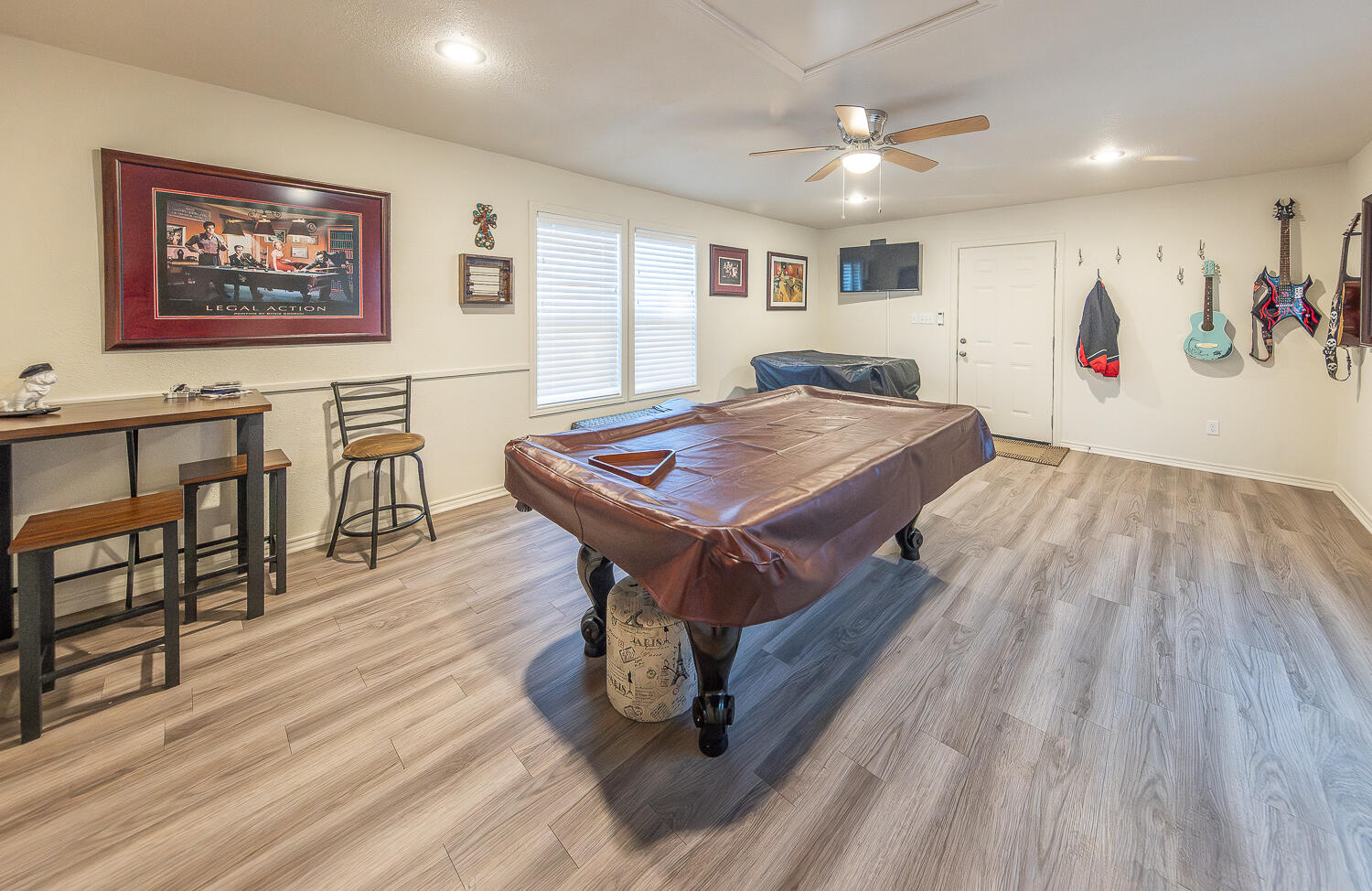 5810 80th Street Lubbock, TX 79424 - Photo 27 of 29 a room with furniture and wooden floor