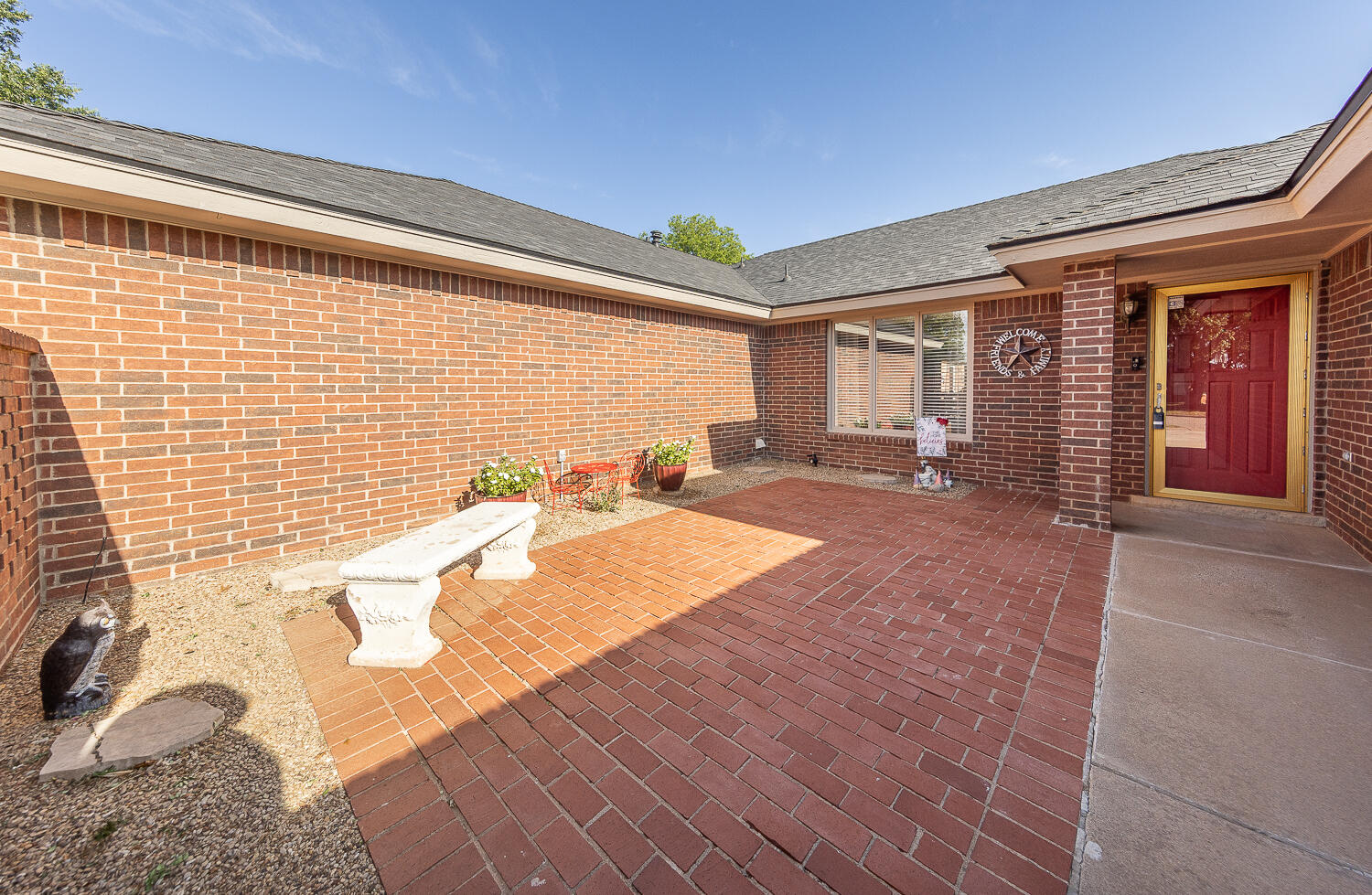 5810 80th Street Lubbock, TX 79424 - Photo 28 of 29 a spacious bedroom with a large bed and large windows