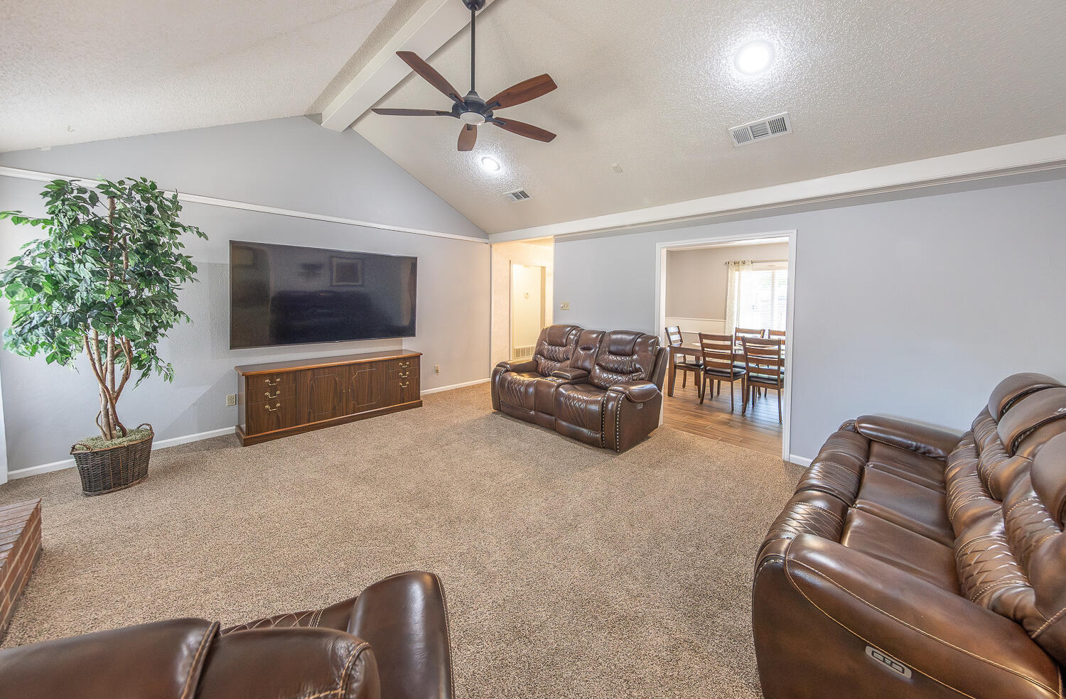 5810 80th Street Lubbock, TX 79424 - Photo 4 of 29 a living room with furniture and a flat screen tv