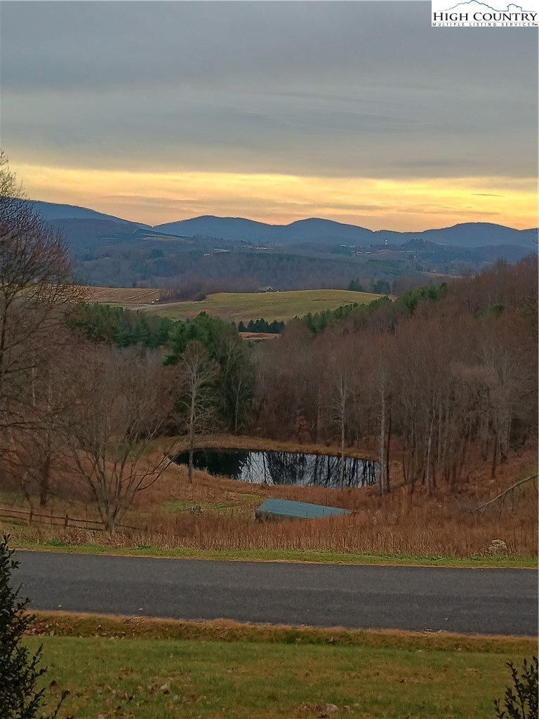 308 Hickory Mountain Road Sparta, NC 28675 - Photo 3 of 26 a view of lake with mountain