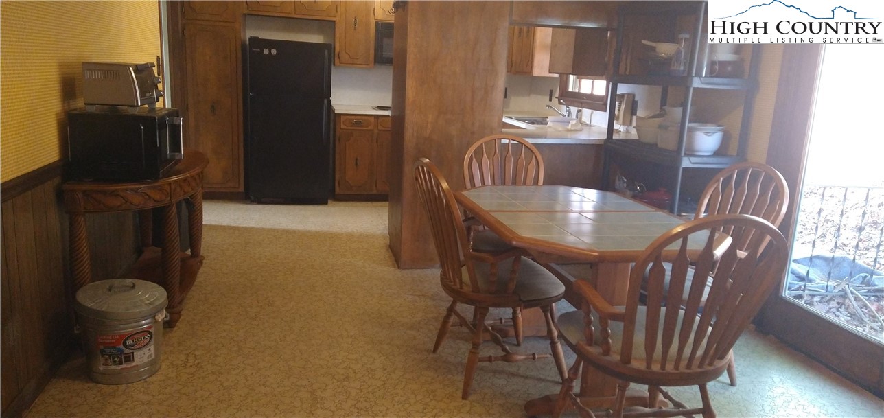 308 Hickory Mountain Road Sparta, NC 28675 - Photo 10 of 26 a dining room with furniture and window