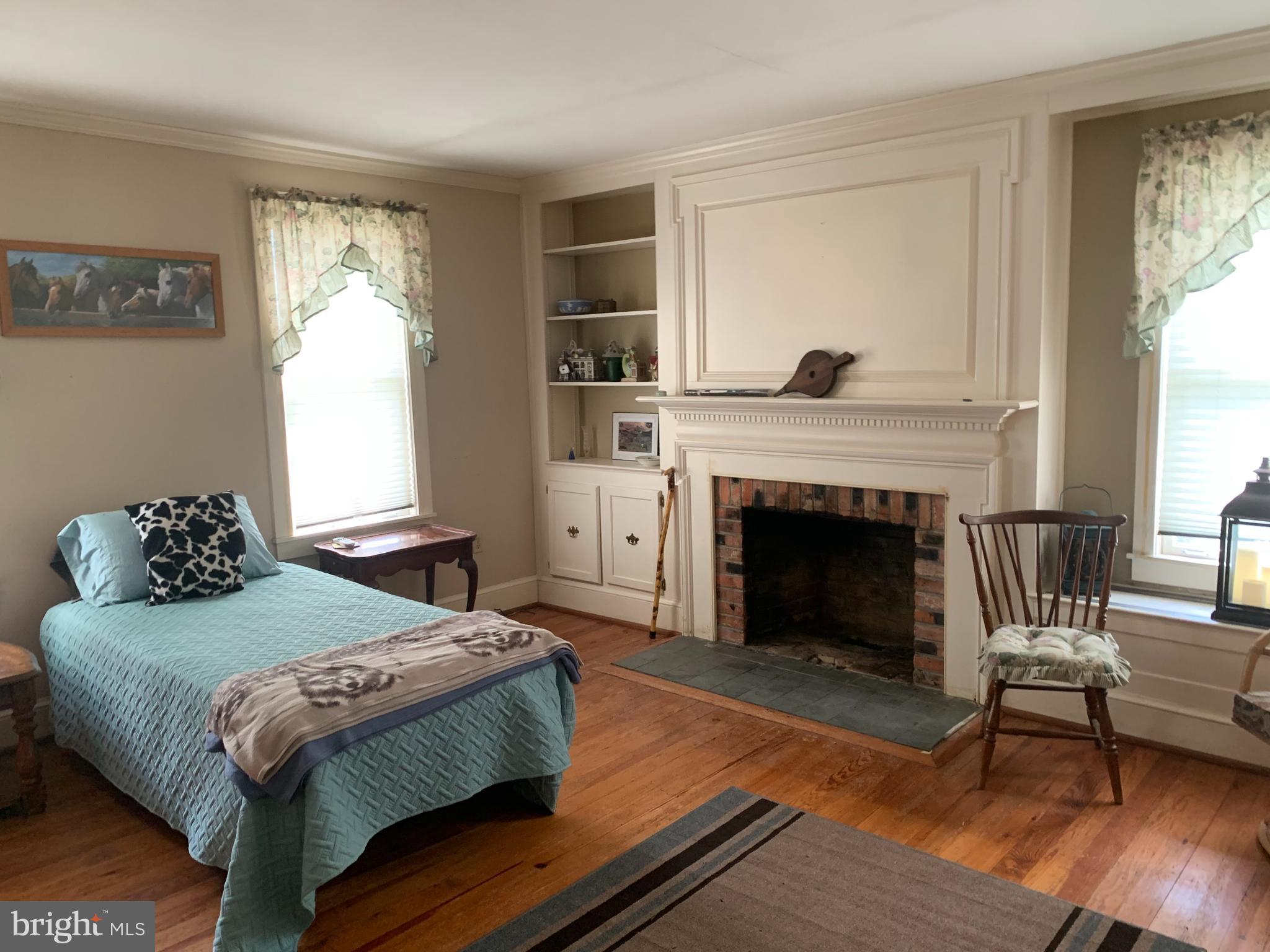 27528 Substation Road Denton, MD 21629 - Photo 5 of 21 LIVING ROOM/BEDROOM WITH FIREPLACE