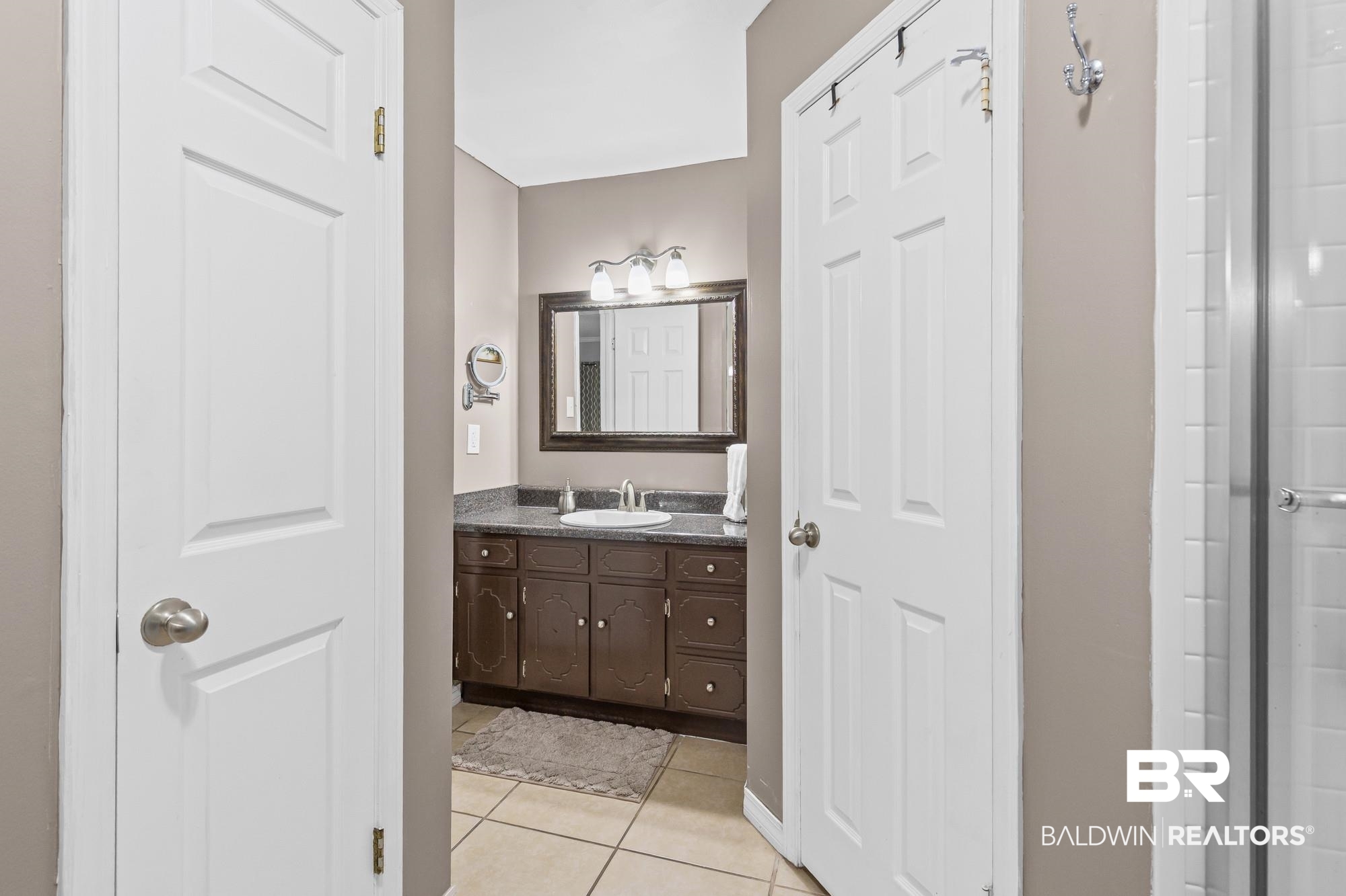 6609 Blakeley Court Mobile, AL 36695 - Photo 22 of 28 Bathroom with vanity and light tile patterned flooring