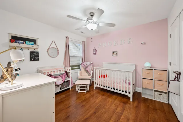 a bedroom with furniture and a window