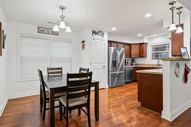 a kitchen with cabinets and stainless steel appliances