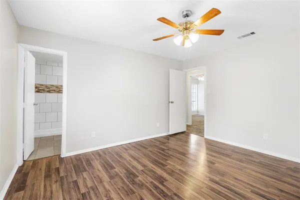 a kitchen with a stove a sink dishwasher and a refrigerator