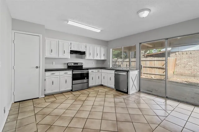 a view of livingroom with window fireplace and wooden floor