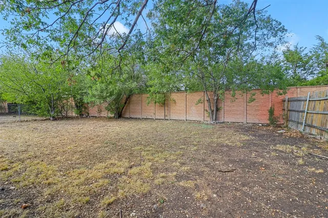 a couple of potted plants in front of door