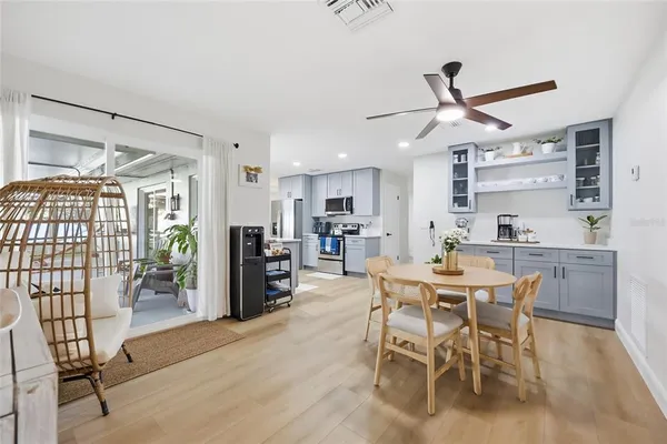 a view of a dining room with furniture window and wooden floor