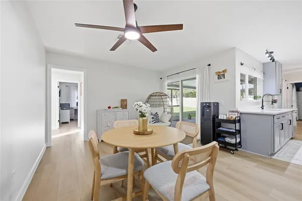 a view of a dining room with furniture window and wooden floor